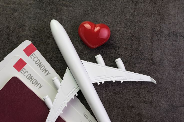 Plane with love heart and boarding passes