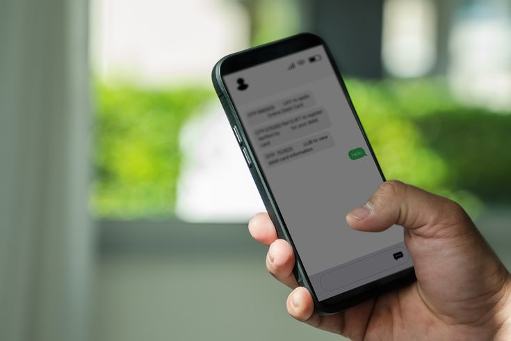 Man holding phone receiving messages