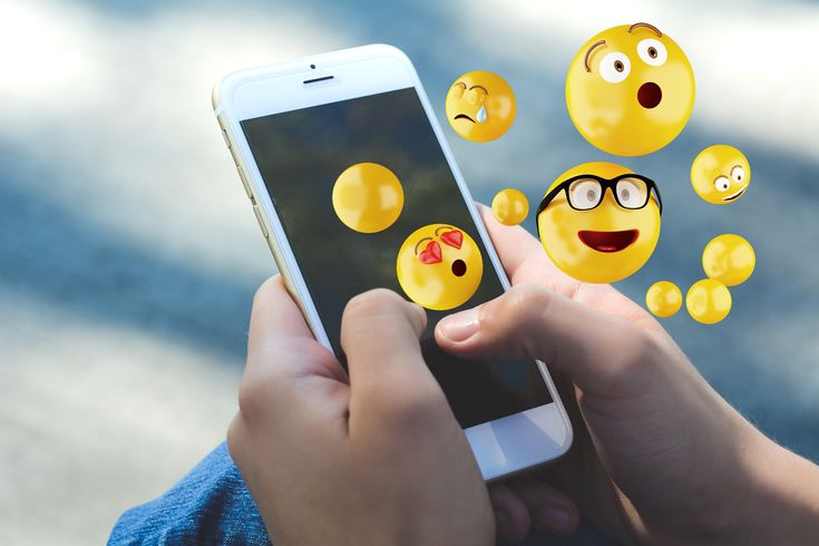emojis coming out of phone